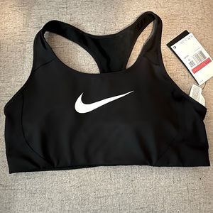 Never worn medium support Nike sports bra!